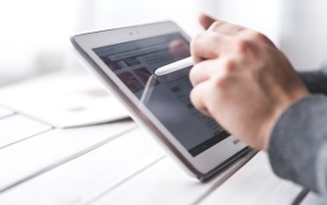man drawing on tab